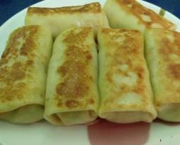 Pancakes in milk stuffed with minced meat